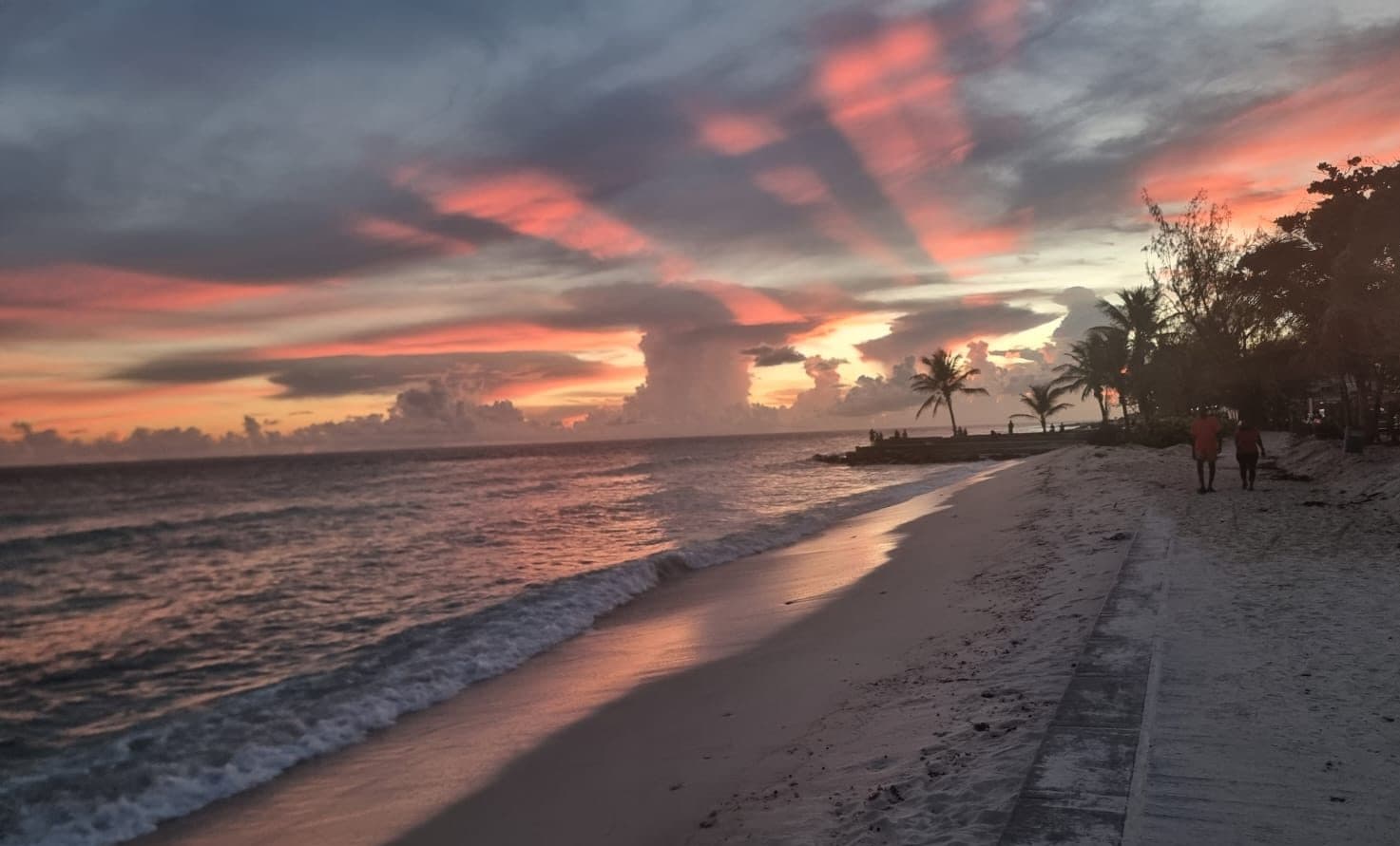 Sunset over a Barbados beach, a romantic setting for couples staying on the island